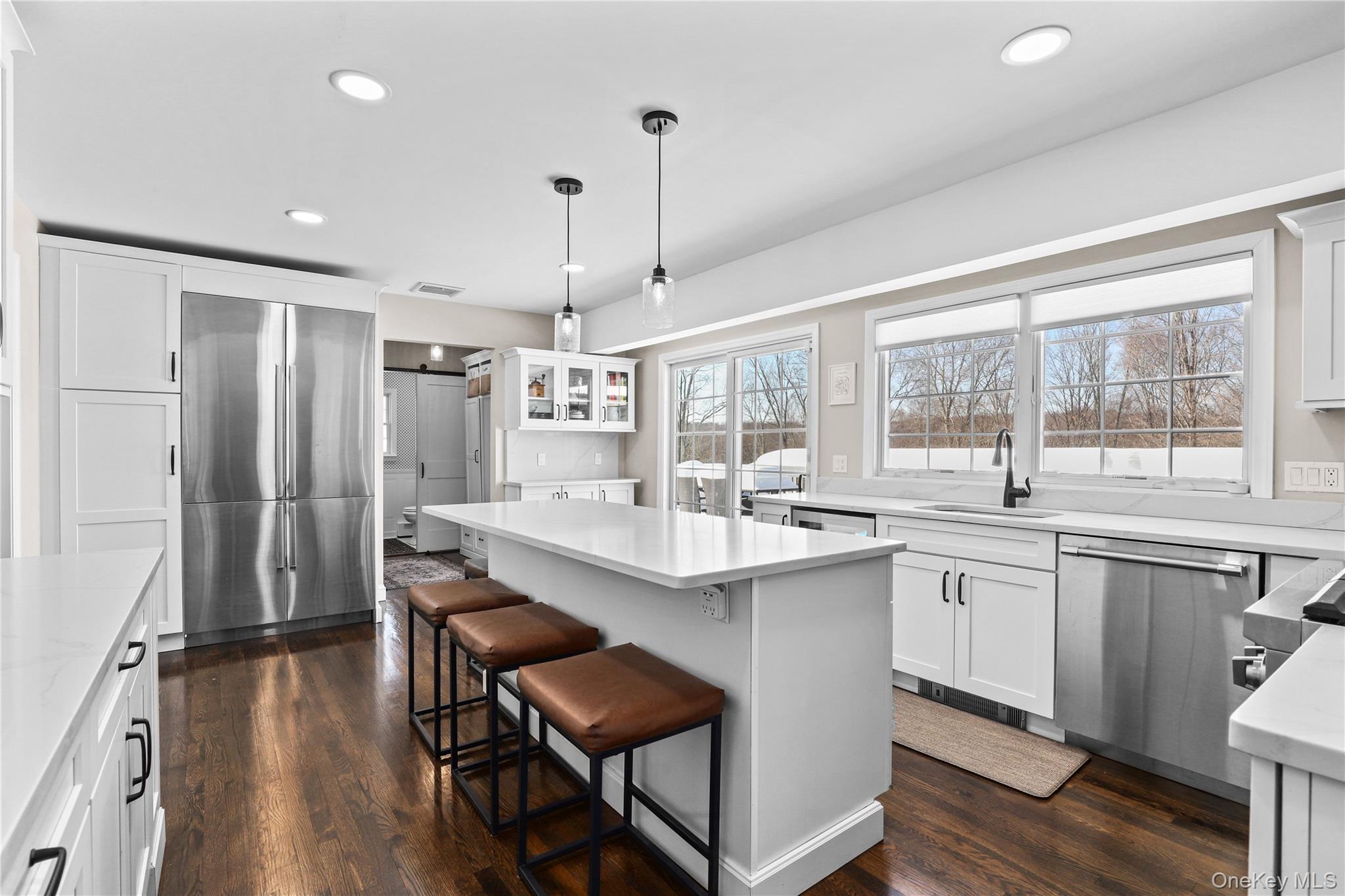 288 Todd Road Katonah, NY 10536 - Photo 8 of 32 Newly renovated kitchen with stainless-steel appliances and quartz countertops.