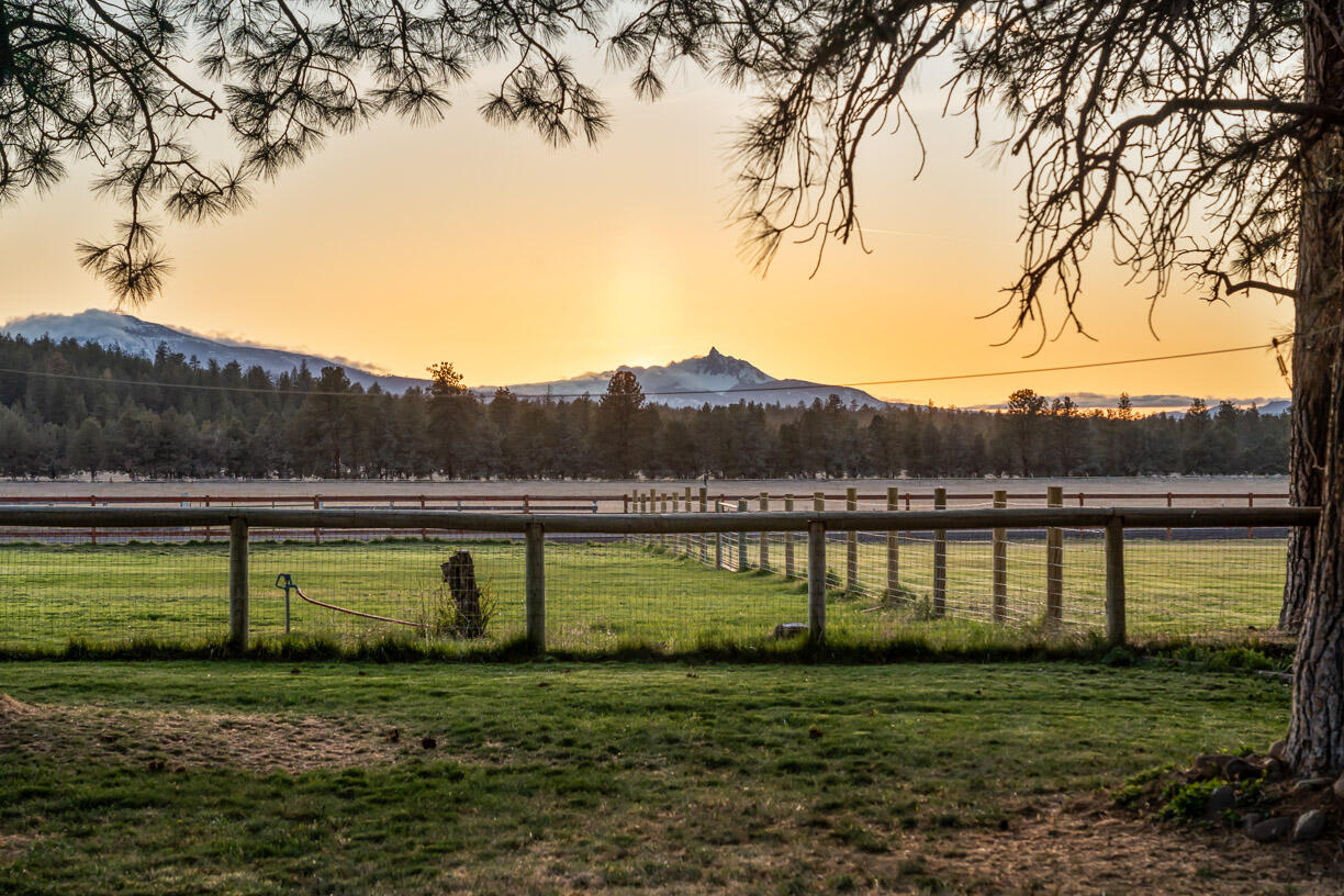 67500 Harrington Loop Road Bend, OR 97703 - Photo 54 of 72 a view of a lake with houses in the back