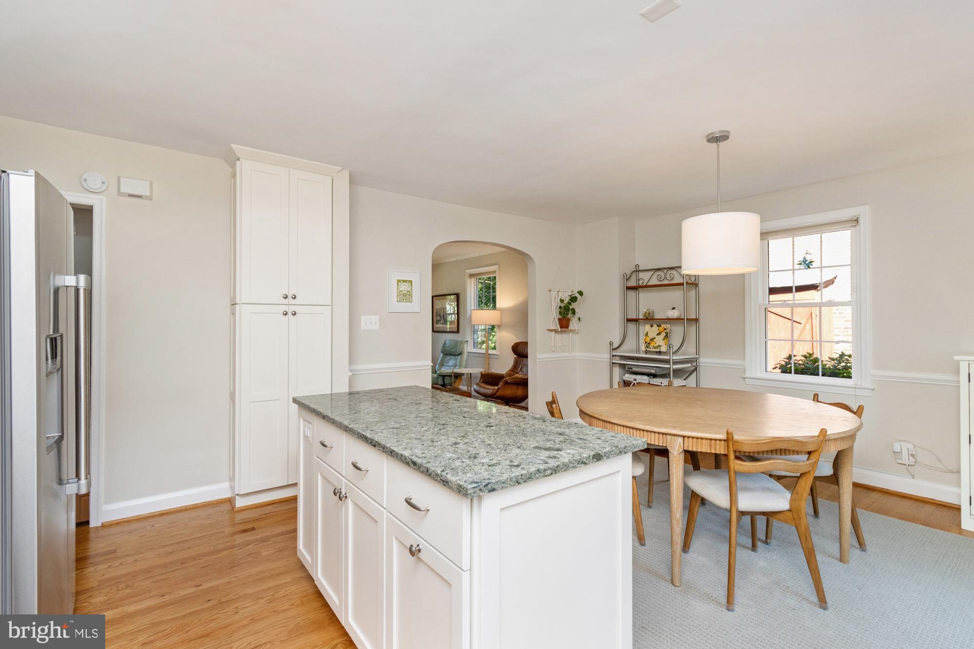 107 Stanmore Road Baltimore, MD 21212 - Photo 6 of 35 a view of a kitchen area with furniture and wooden floor