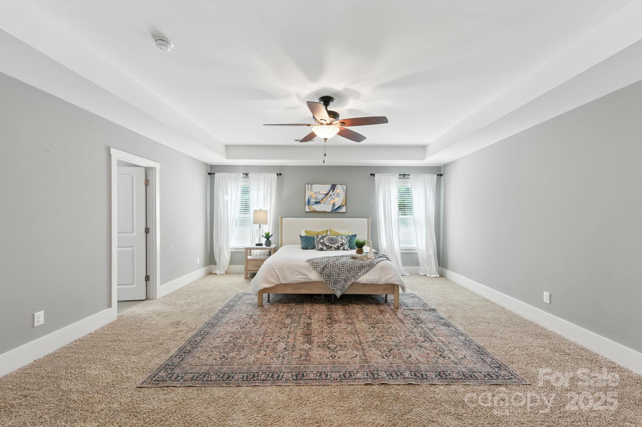 3076 Amaranth Drive Tega Cay, SC 29708 - Photo 18 of 39 a living room with furniture and a chandelier