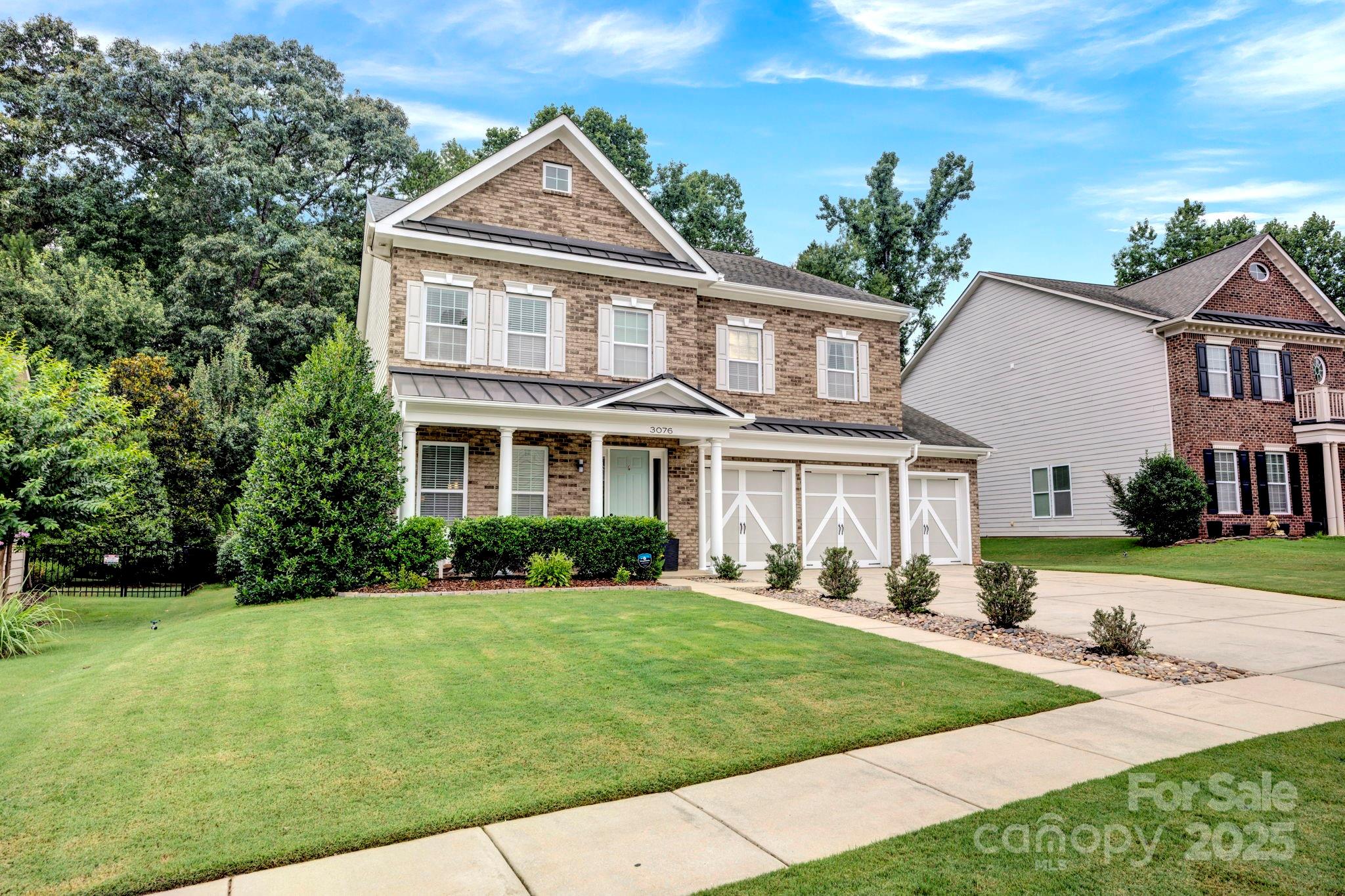 3076 Amaranth Drive Tega Cay, SC 29708 - Photo 2 of 39 a front view of a house with a yard