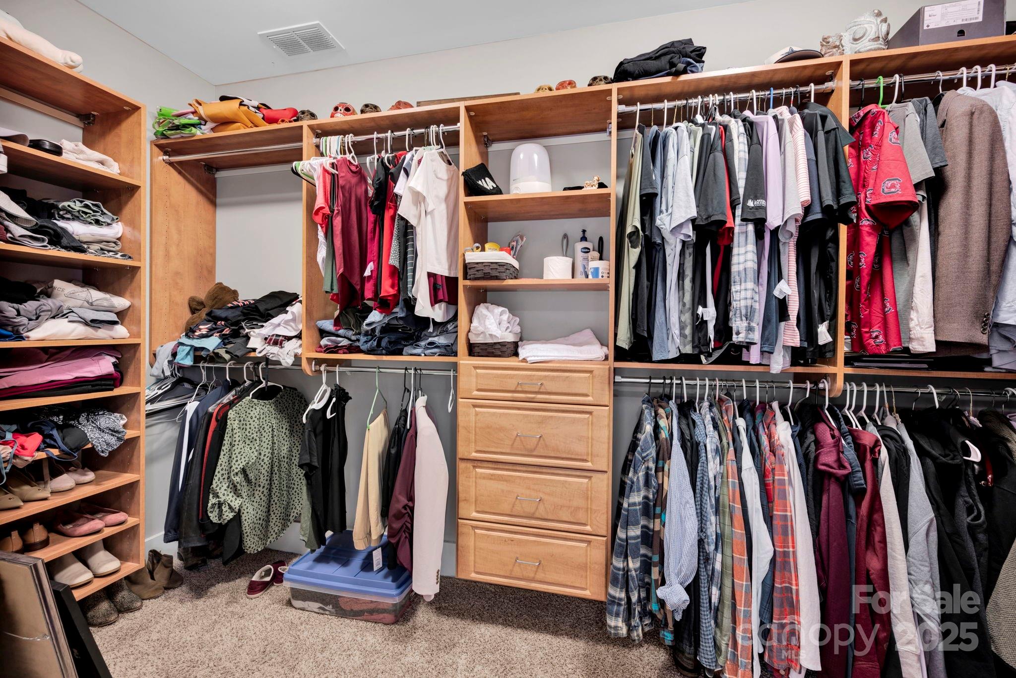 3076 Amaranth Drive Tega Cay, SC 29708 - Photo 22 of 39 a view of walk in closet with clothes
