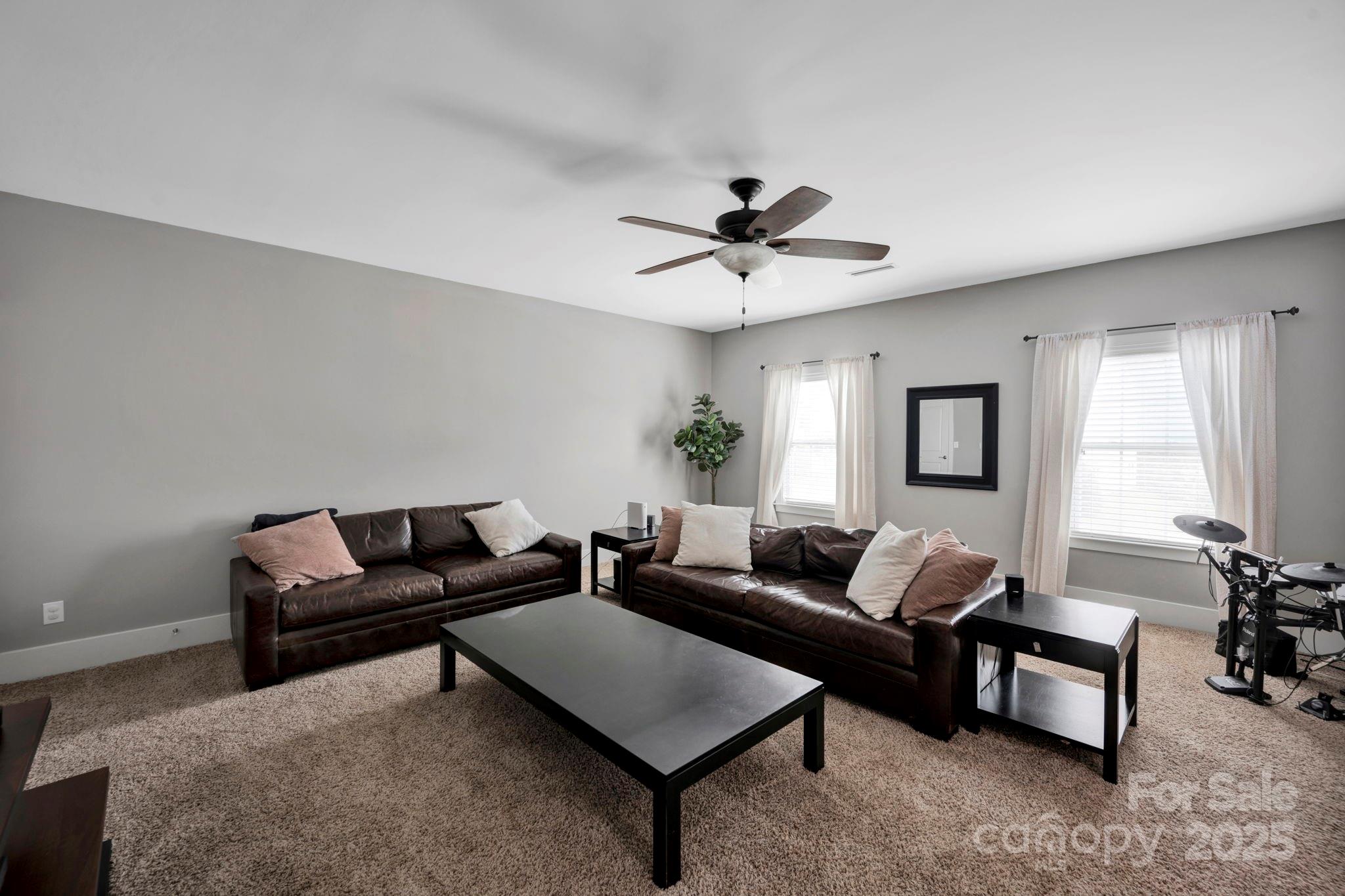 3076 Amaranth Drive Tega Cay, SC 29708 - Photo 23 of 39 a living room with furniture and a wooden floor
