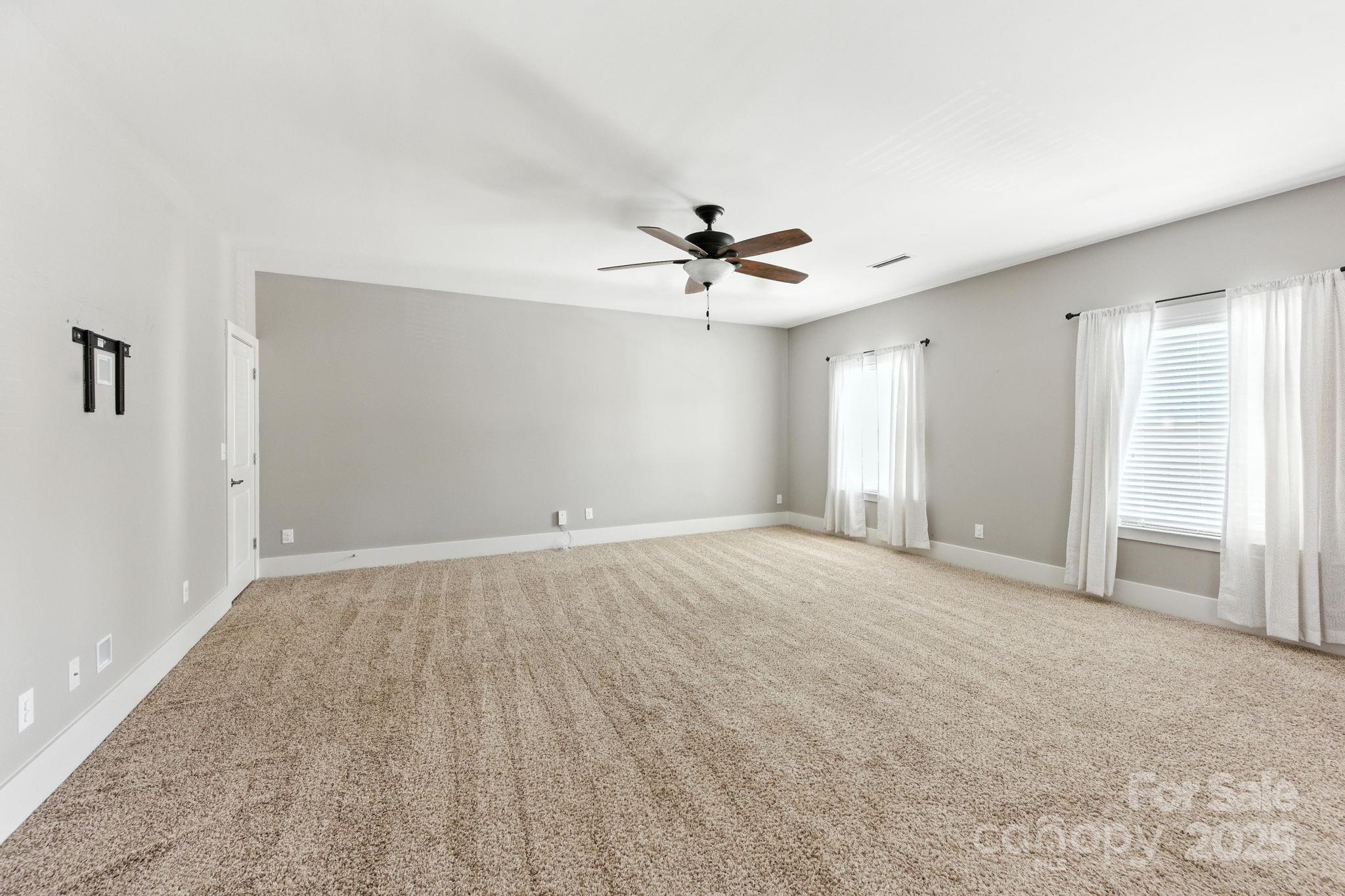3076 Amaranth Drive Tega Cay, SC 29708 - Photo 24 of 39 a view of an empty room with a window
