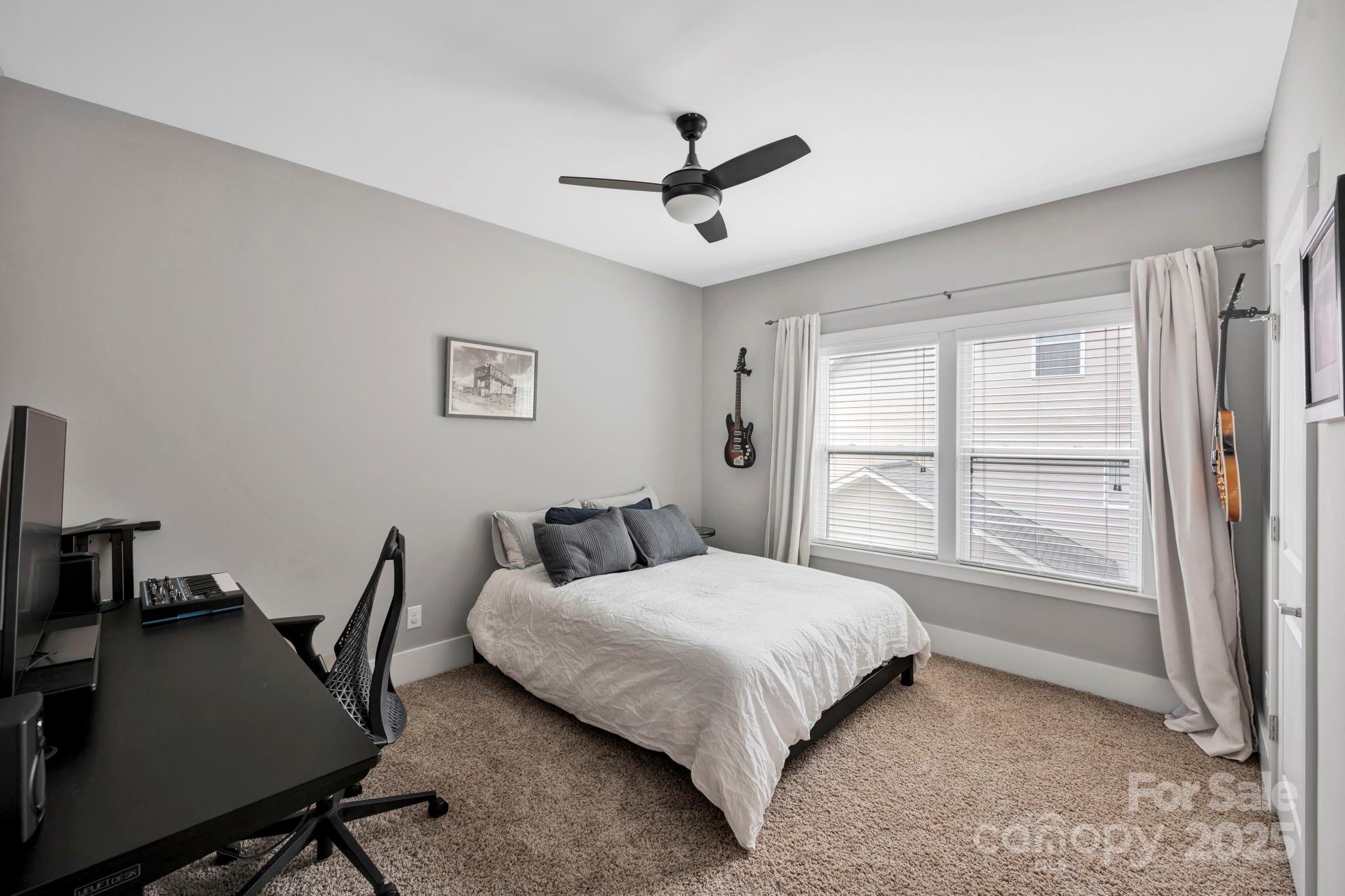 3076 Amaranth Drive Tega Cay, SC 29708 - Photo 28 of 39 a bedroom with a bed window and a desk