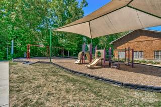 3076 Amaranth Drive Tega Cay, SC 29708 - Photo 35 of 39 a view of a wooden deck and a backyard
