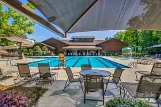 3076 Amaranth Drive Tega Cay, SC 29708 - Photo 37 of 39 an outdoor space with furniture and umbrella