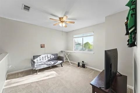 a bedroom with furniture and a window