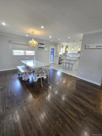 a room with lots of furniture and wooden floor