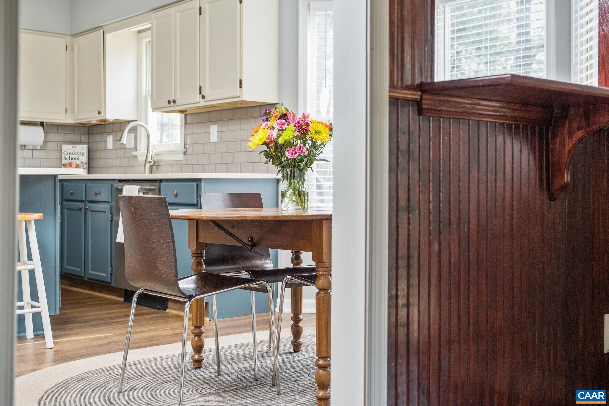 1143 Raintree Drive Charlottesville, VA 22901 - Photo 12 of 49 a kitchen with granite countertop sink and cabinets