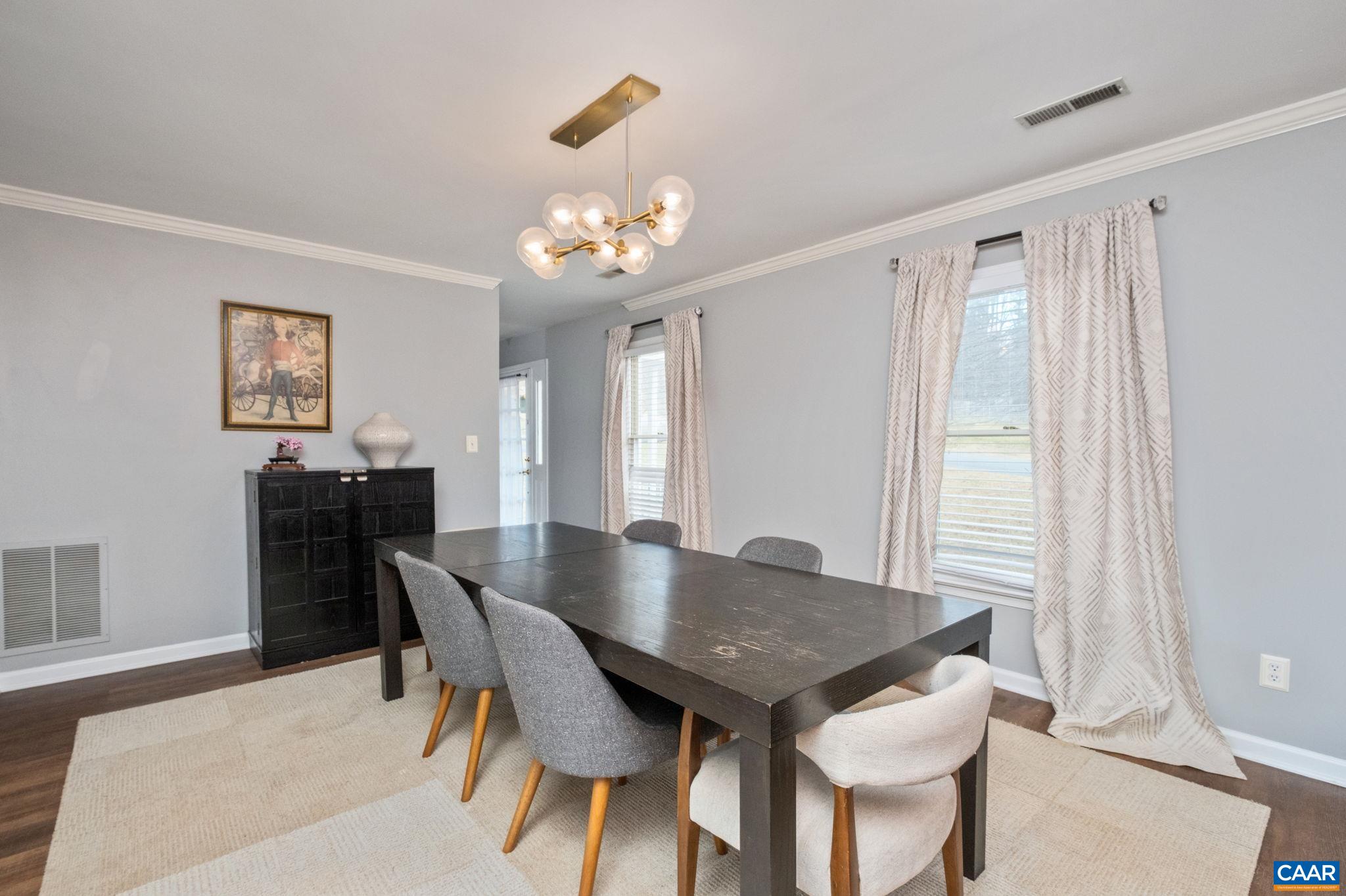 1143 Raintree Drive Charlottesville, VA 22901 - Photo 14 of 49 a view of a dining room with furniture and chandelier