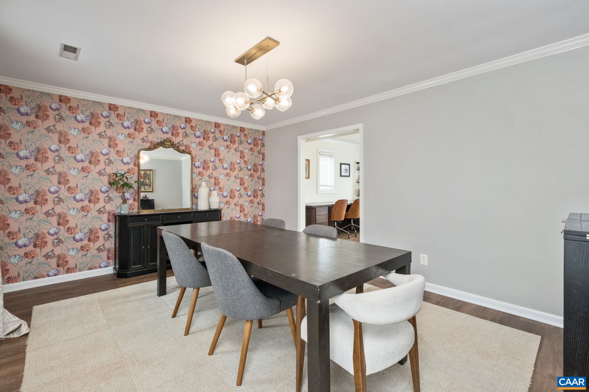 1143 Raintree Drive Charlottesville, VA 22901 - Photo 15 of 49 a view of a dining room with furniture and chandelier