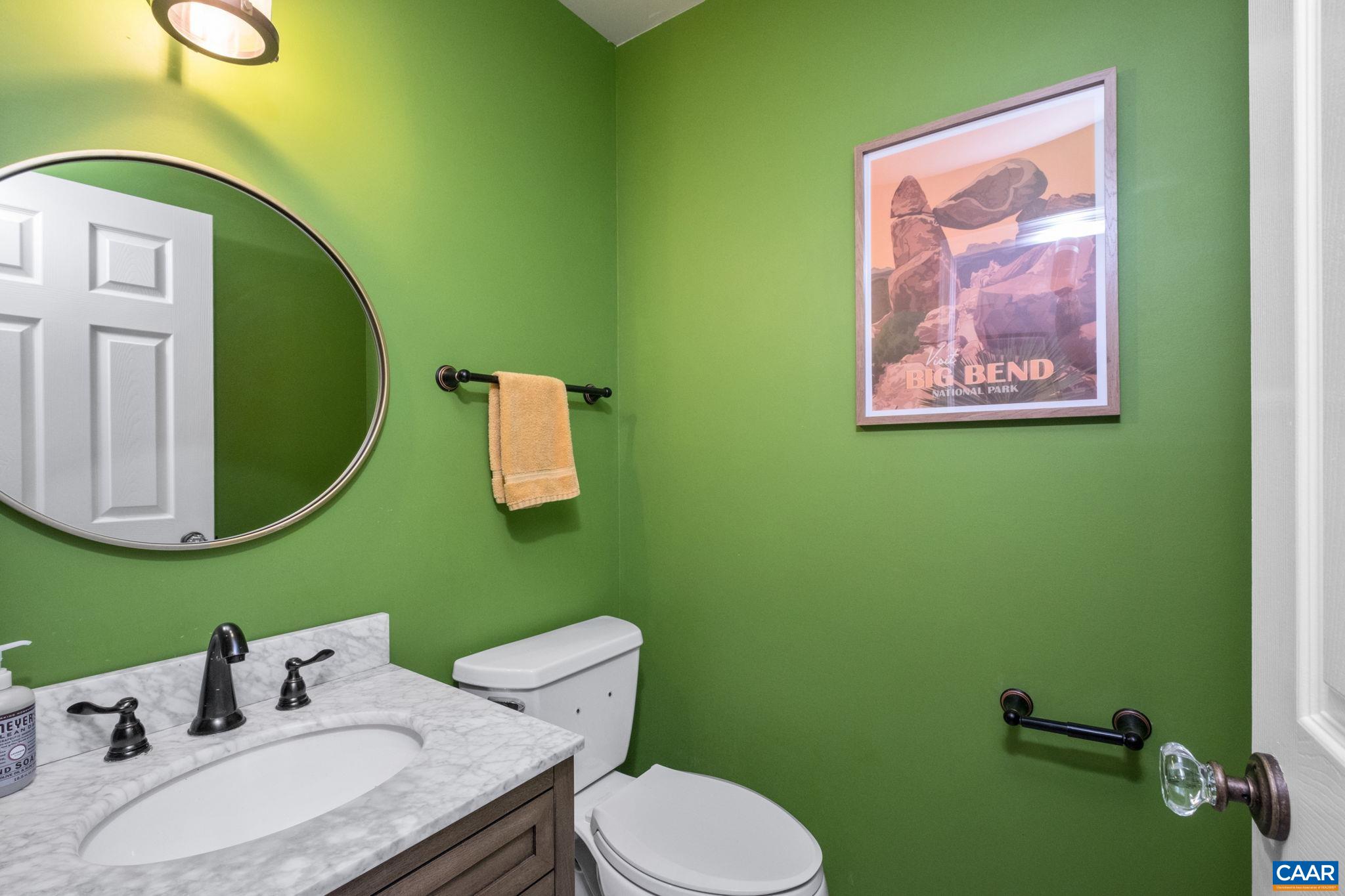 1143 Raintree Drive Charlottesville, VA 22901 - Photo 17 of 49 a bathroom with a toilet sink and mirror