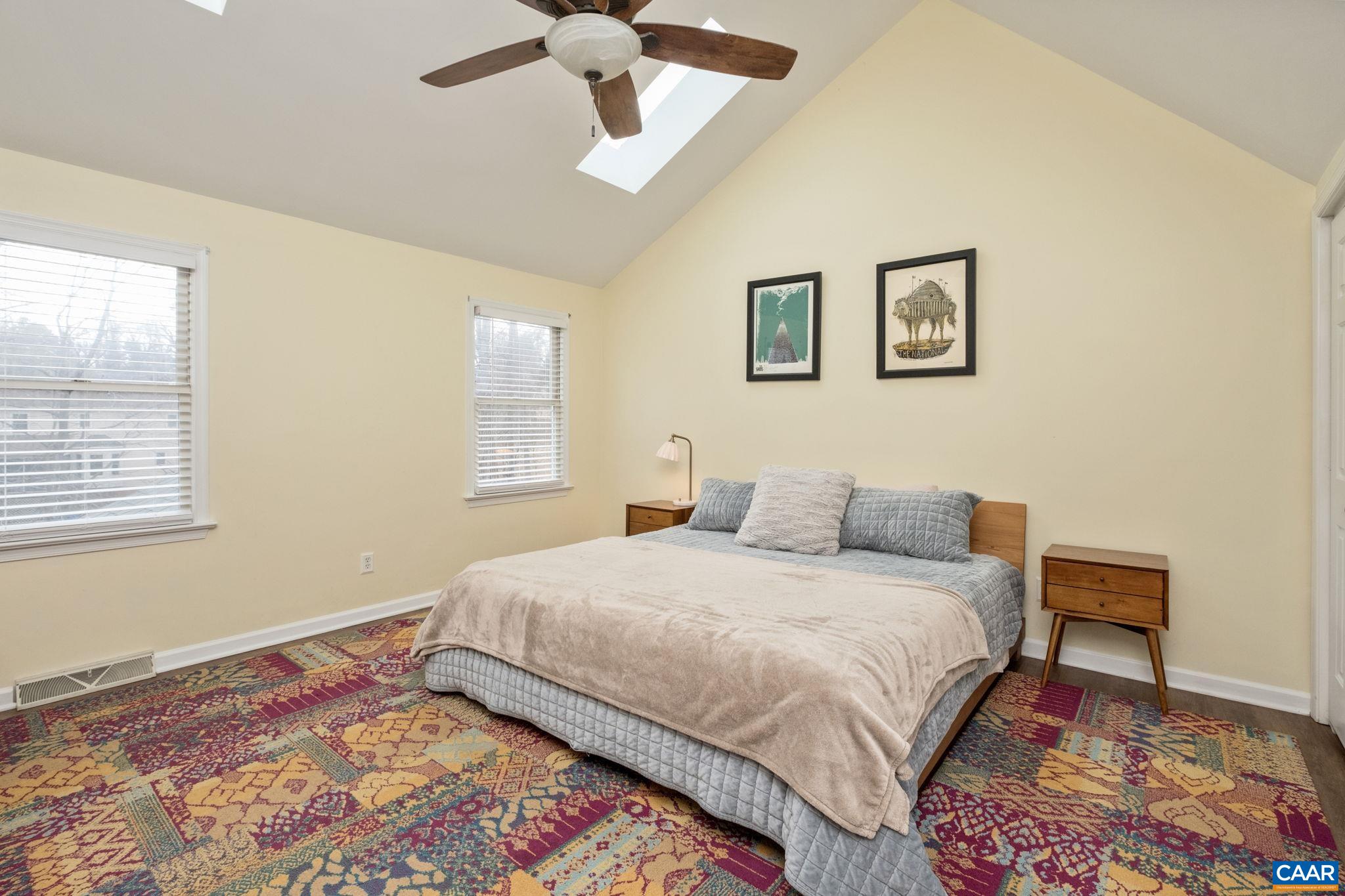 1143 Raintree Drive Charlottesville, VA 22901 - Photo 18 of 49 a bedroom with a bed and a painting on the wall