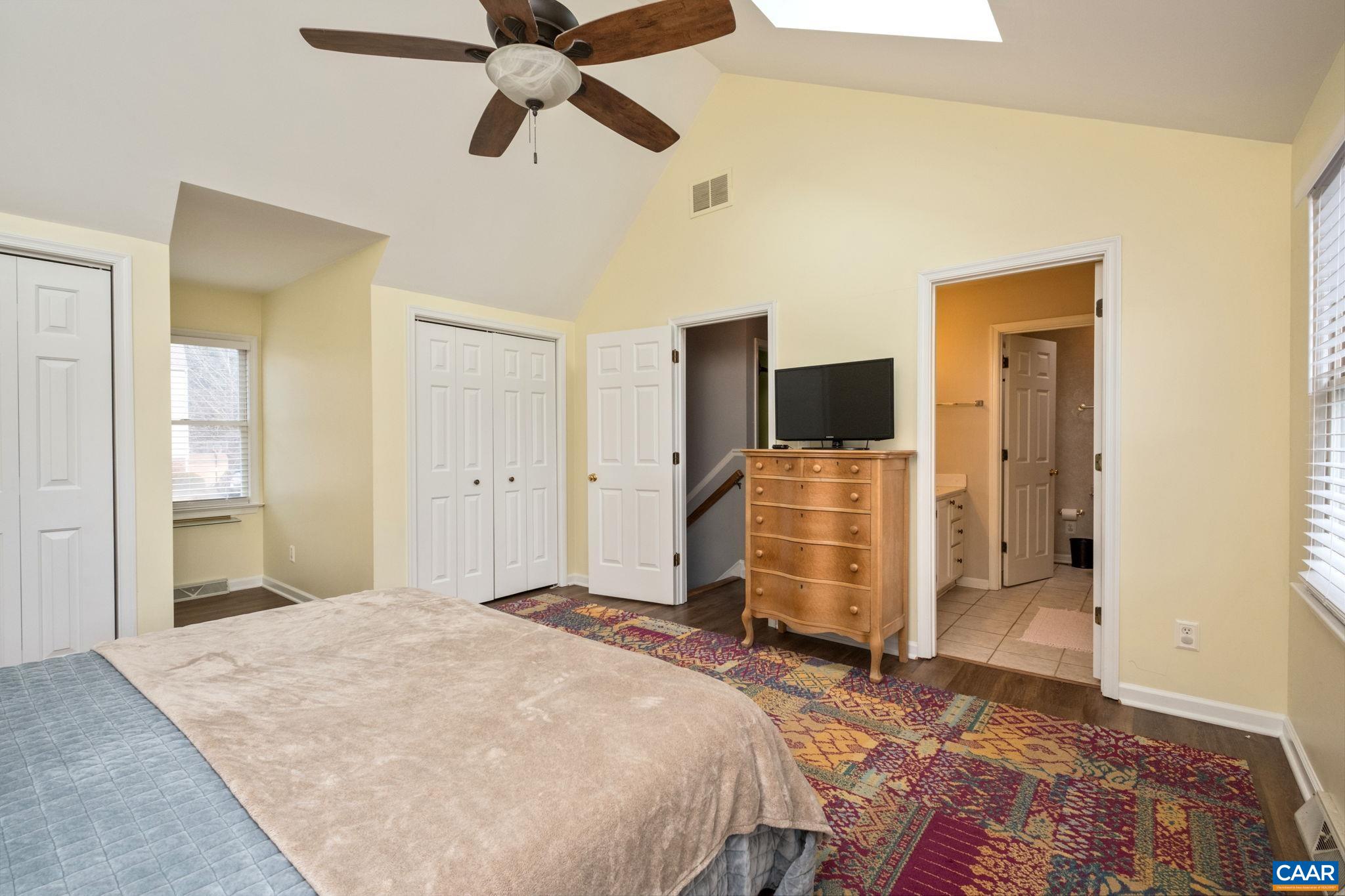1143 Raintree Drive Charlottesville, VA 22901 - Photo 19 of 49 a bedroom with a bed and wooden floor
