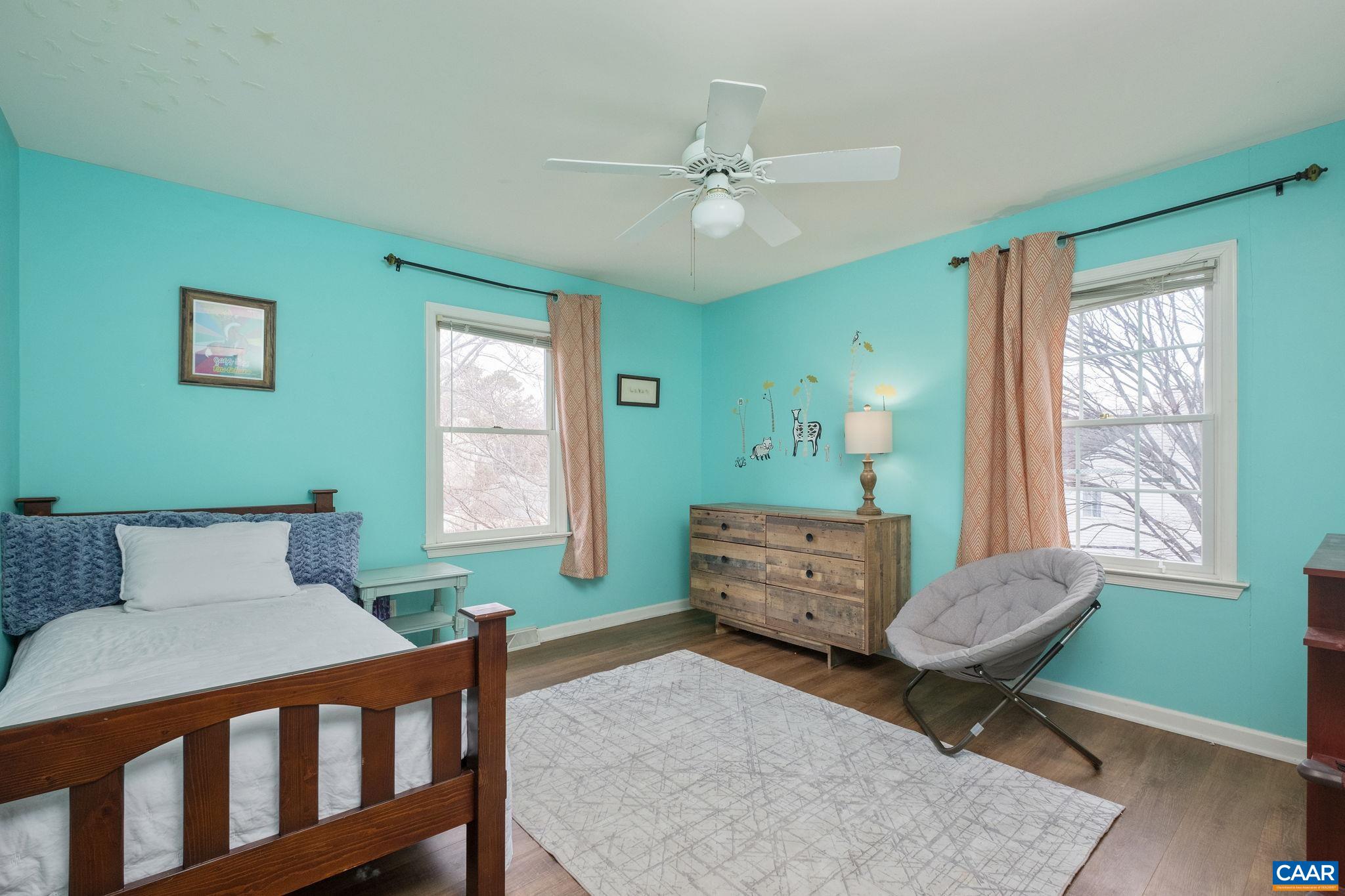 1143 Raintree Drive Charlottesville, VA 22901 - Photo 25 of 49 a bedroom with a bed and wooden floor