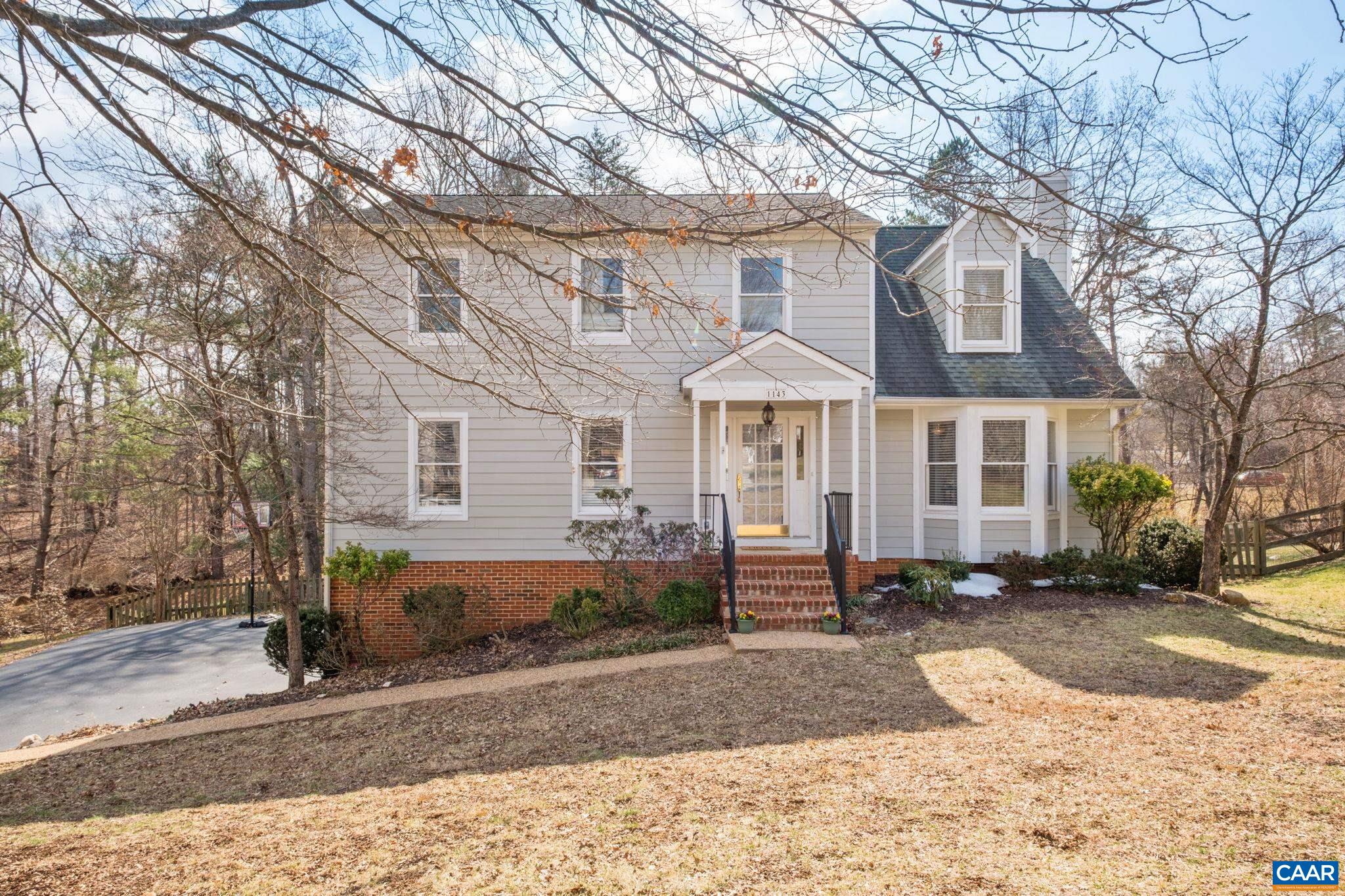 1143 Raintree Drive Charlottesville, VA 22901 - Photo 40 of 49 a front view of a house with a yard and garage