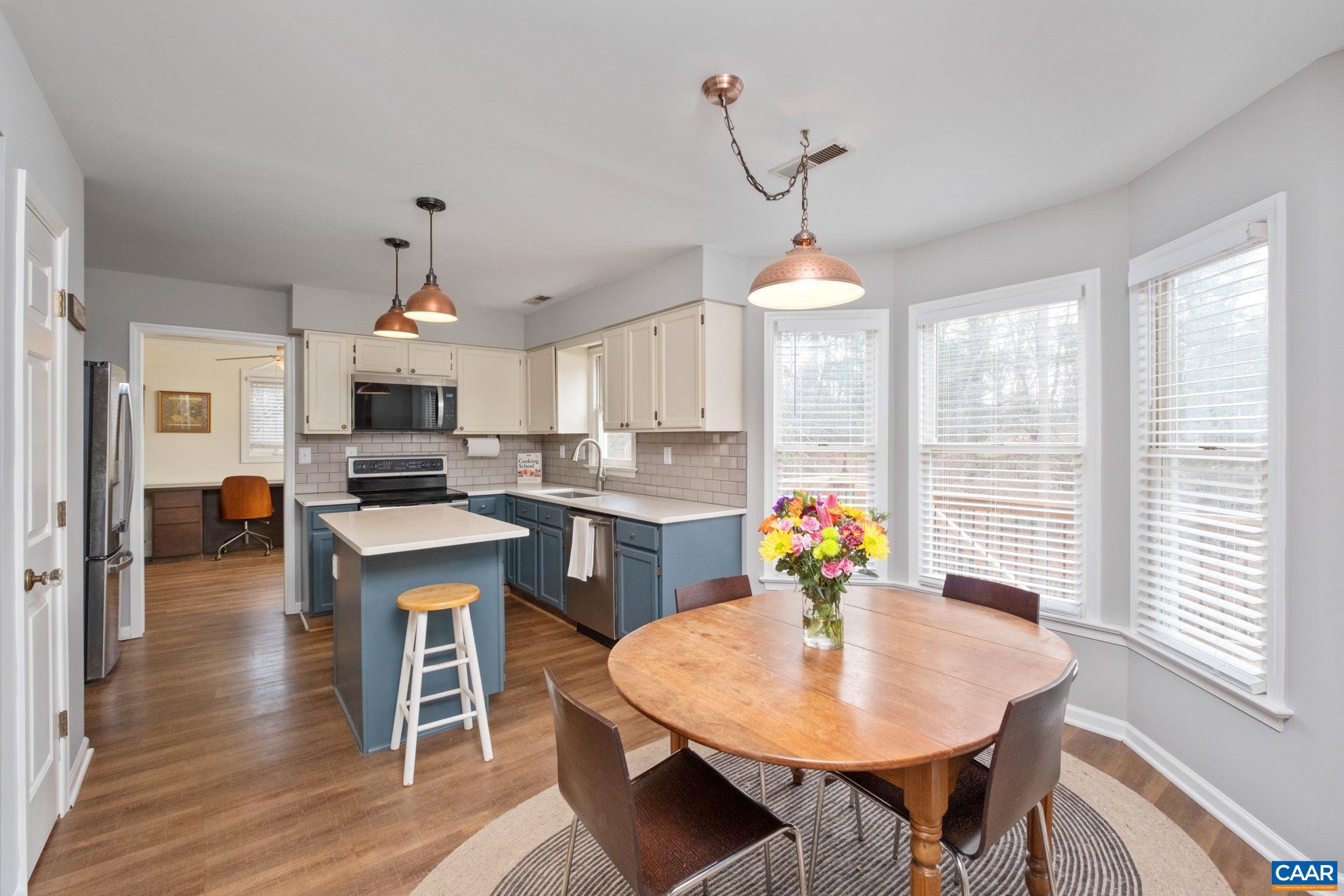 1143 Raintree Drive Charlottesville, VA 22901 - Photo 8 of 49 a kitchen that has a table and chairs in it