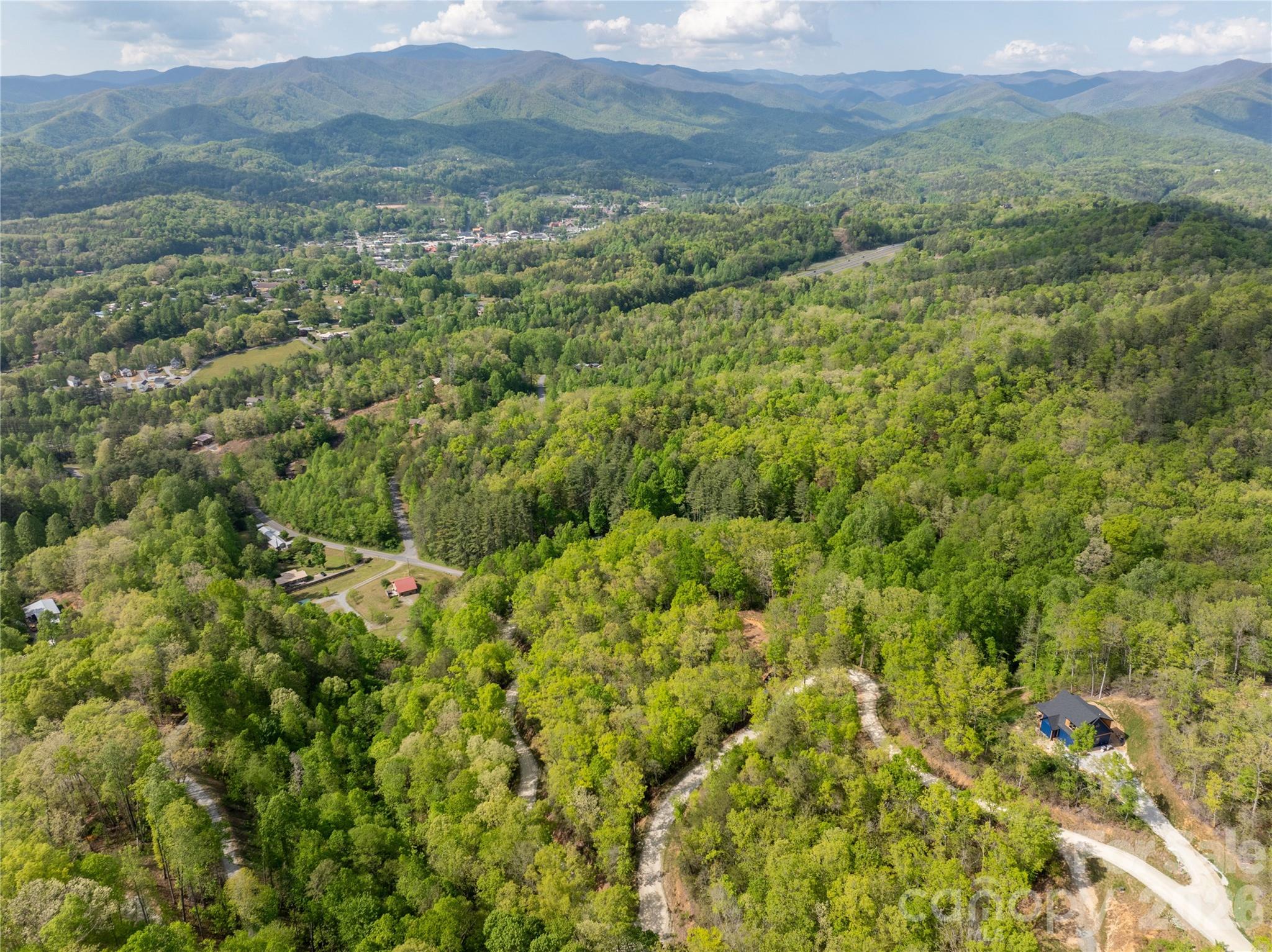 Lot 1 Breedlove Road Bryson City, NC 28713 - Photo 12 of 12 a view of a lush green forest with trees and some houses