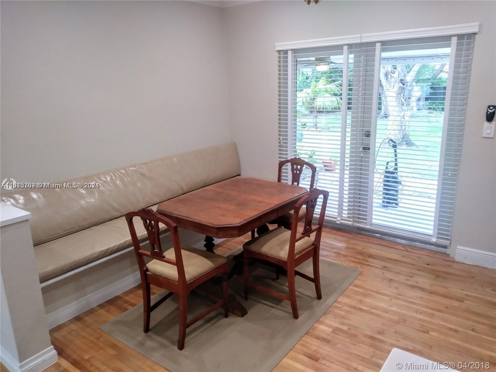 610 Southwest 25th Road Miami, FL 33129 - Photo 11 of 30 a view of a dining room with furniture and wooden floor