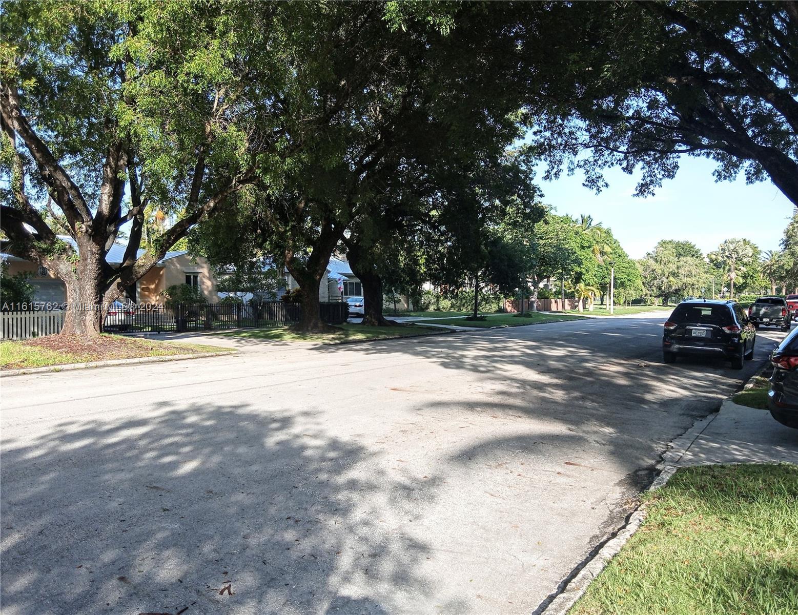 610 Southwest 25th Road Miami, FL 33129 - Photo 25 of 30 a view of yard with swimming pool and trees