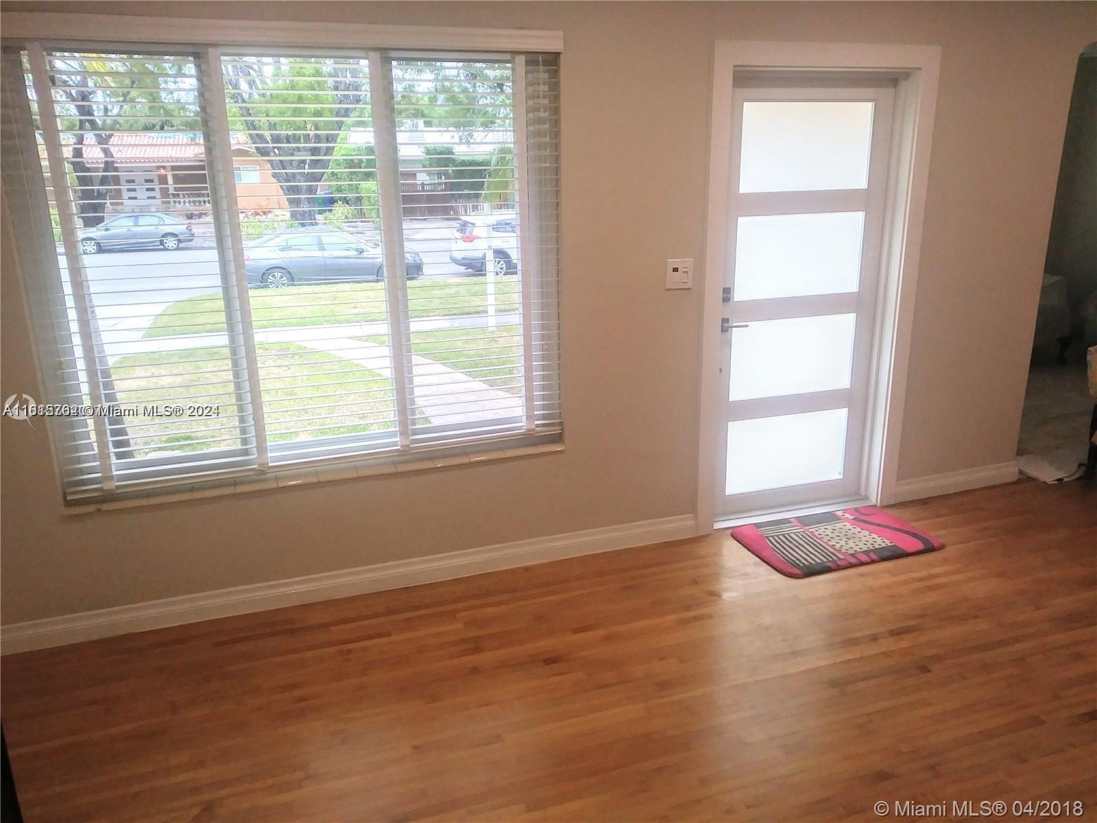 610 Southwest 25th Road Miami, FL 33129 - Photo 10 of 30 a view of wooden floor and windows in a room