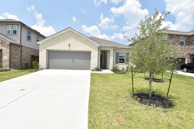 a house view with a backyard space