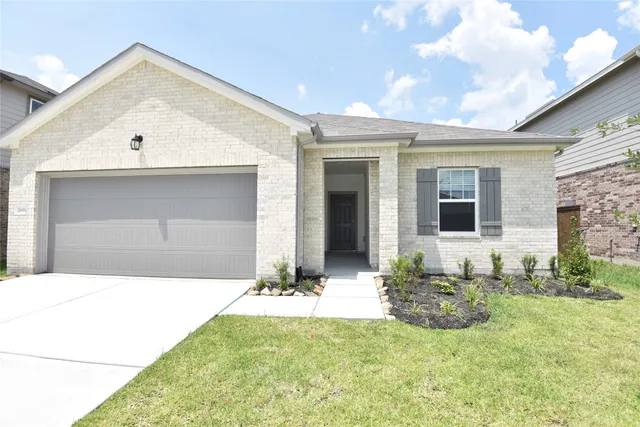a front view of a house with yard