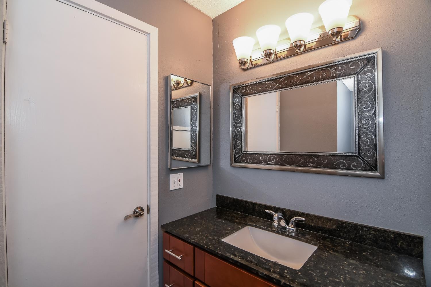 1139 Rivara Circle Sacramento, CA 95864 - Photo 27 of 72 a bathroom with a sink and a mirror