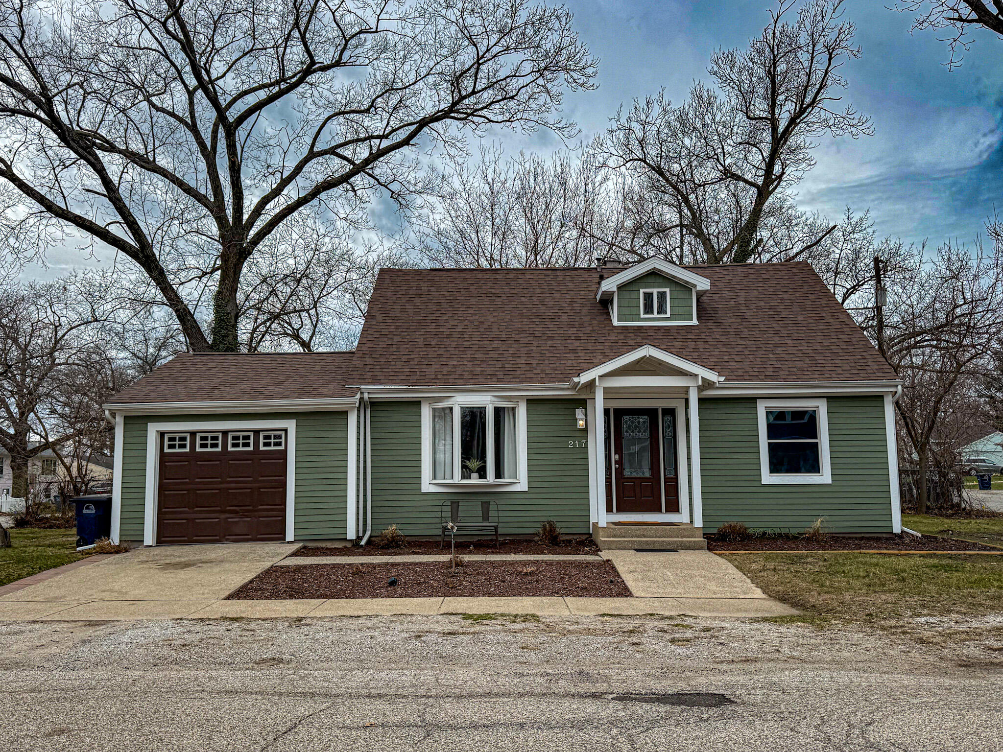 217 Loran Road Michigan City, IN 46360 - Photo 1 of 26 a front view of a house with a yard and garage