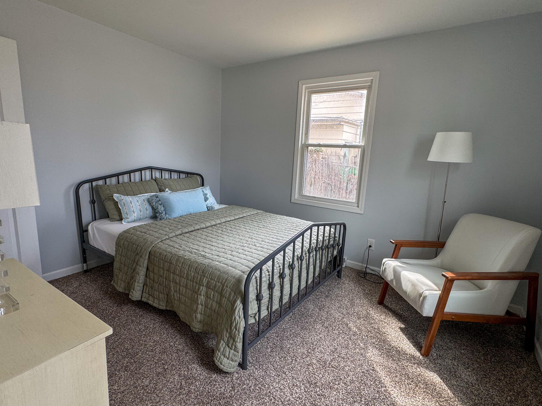 217 Loran Road Michigan City, IN 46360 - Photo 18 of 26 a bedroom with a bed chair and window