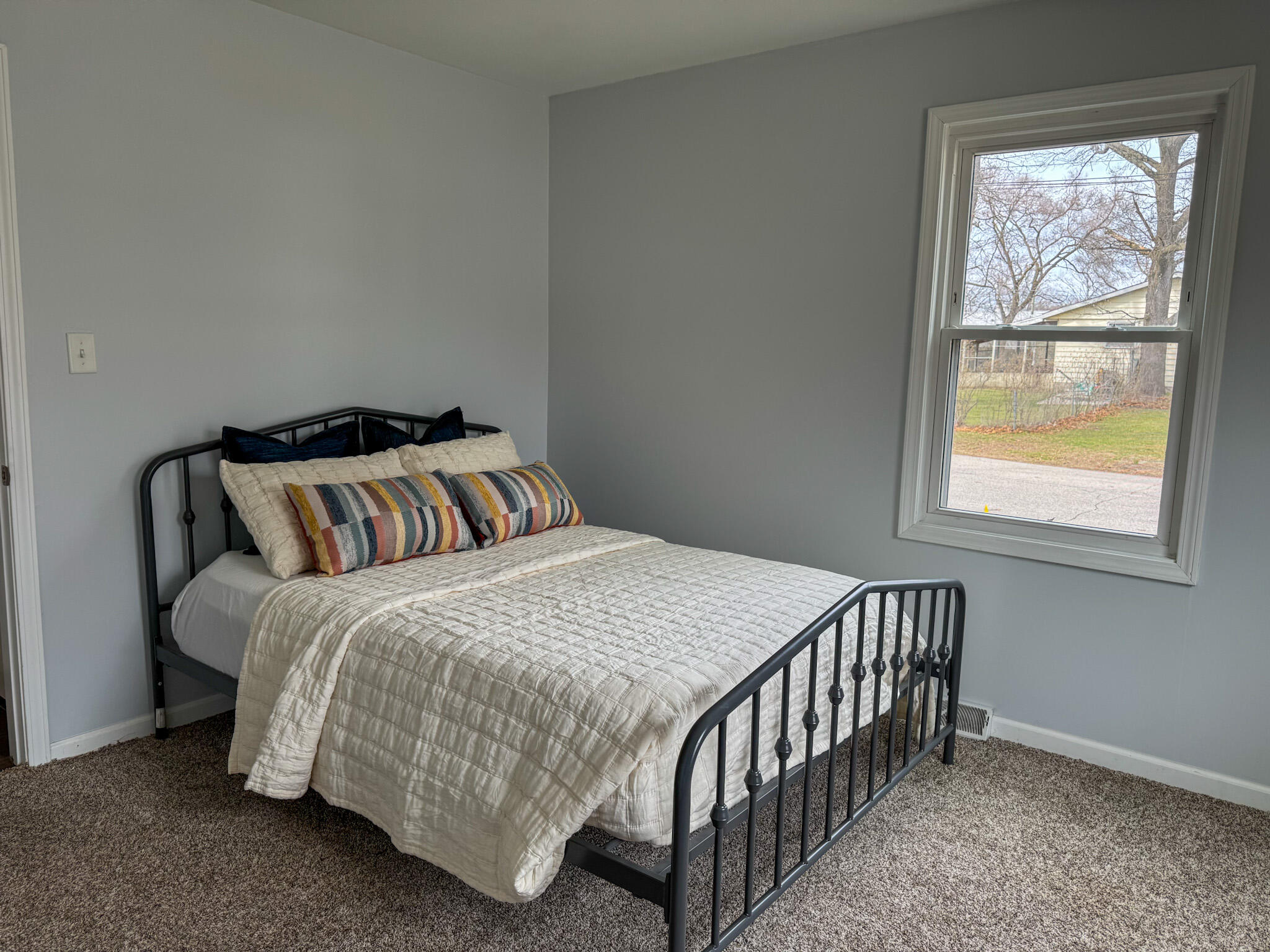 217 Loran Road Michigan City, IN 46360 - Photo 20 of 26 a bedroom with a bed and window