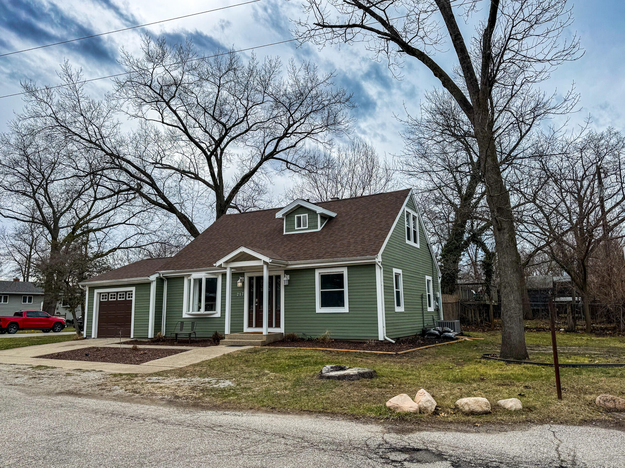 217 Loran Road Michigan City, IN 46360 - Photo 2 of 26 a front view of a house with a yard