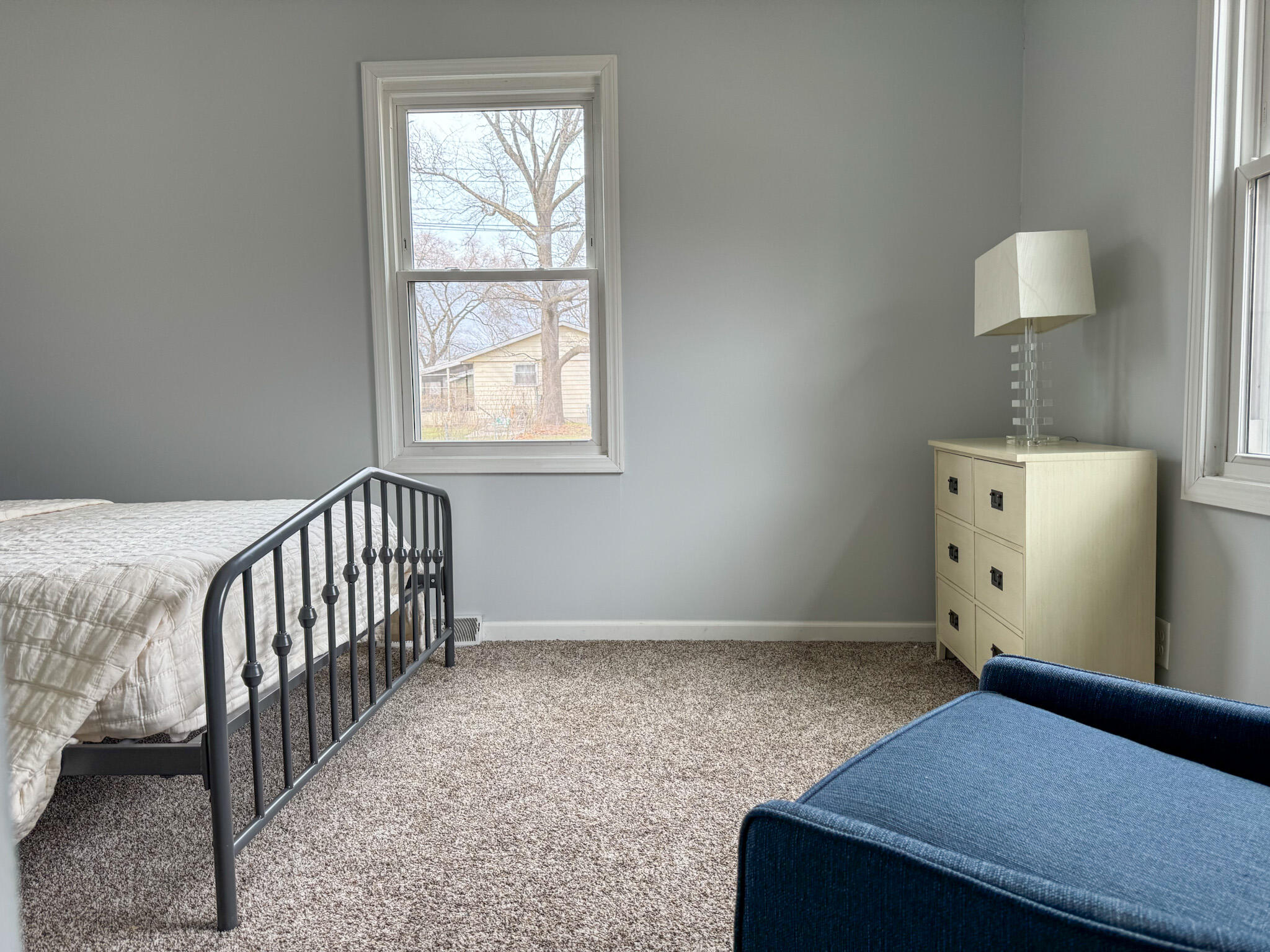 217 Loran Road Michigan City, IN 46360 - Photo 21 of 26 a room with a bed and a lamp