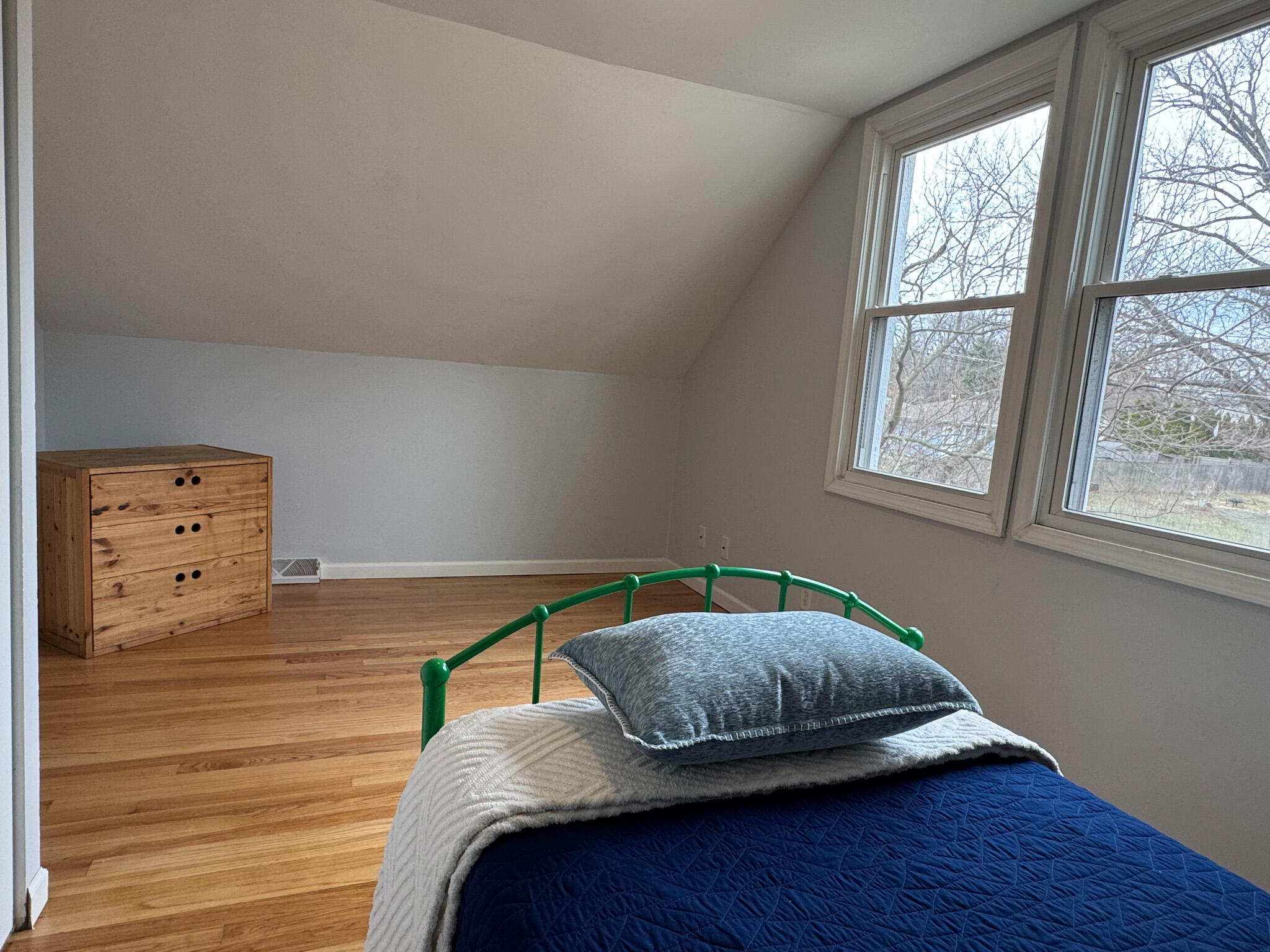 217 Loran Road Michigan City, IN 46360 - Photo 24 of 26 a bedroom with a bed and wooden floor