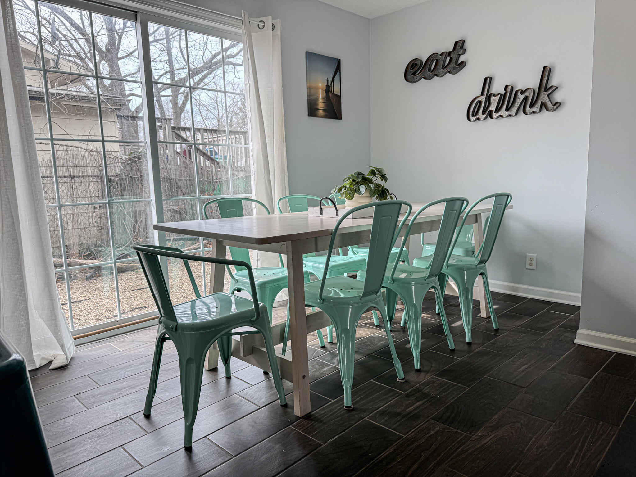 217 Loran Road Michigan City, IN 46360 - Photo 7 of 26 a view of a dining room with furniture window and wooden floor