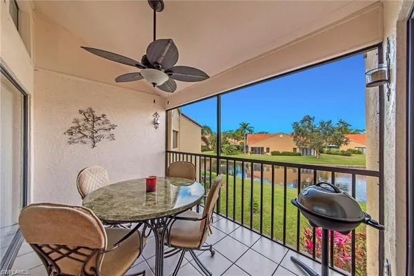 a view of a chairs and table in a balcony