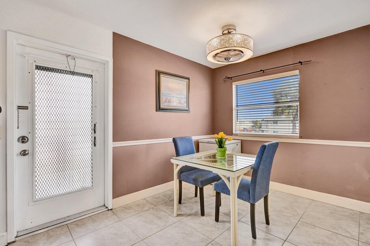 505 Monaco Way Delray Beach, FL 33446 - Photo 14 of 58 a view of a dining room with furniture