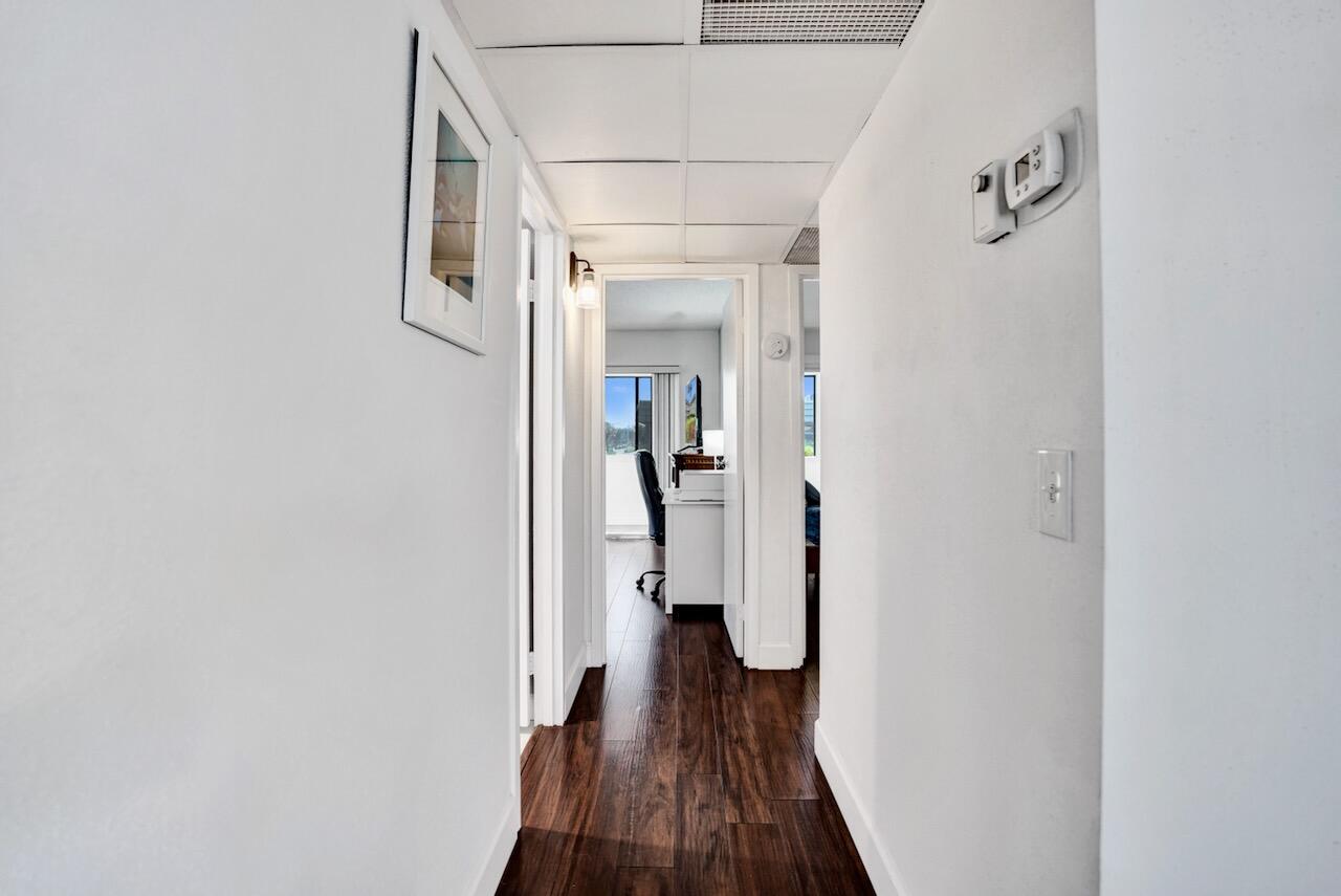 505 Monaco Way Delray Beach, FL 33446 - Photo 23 of 58 a view of a hallway with wooden floor and staircase