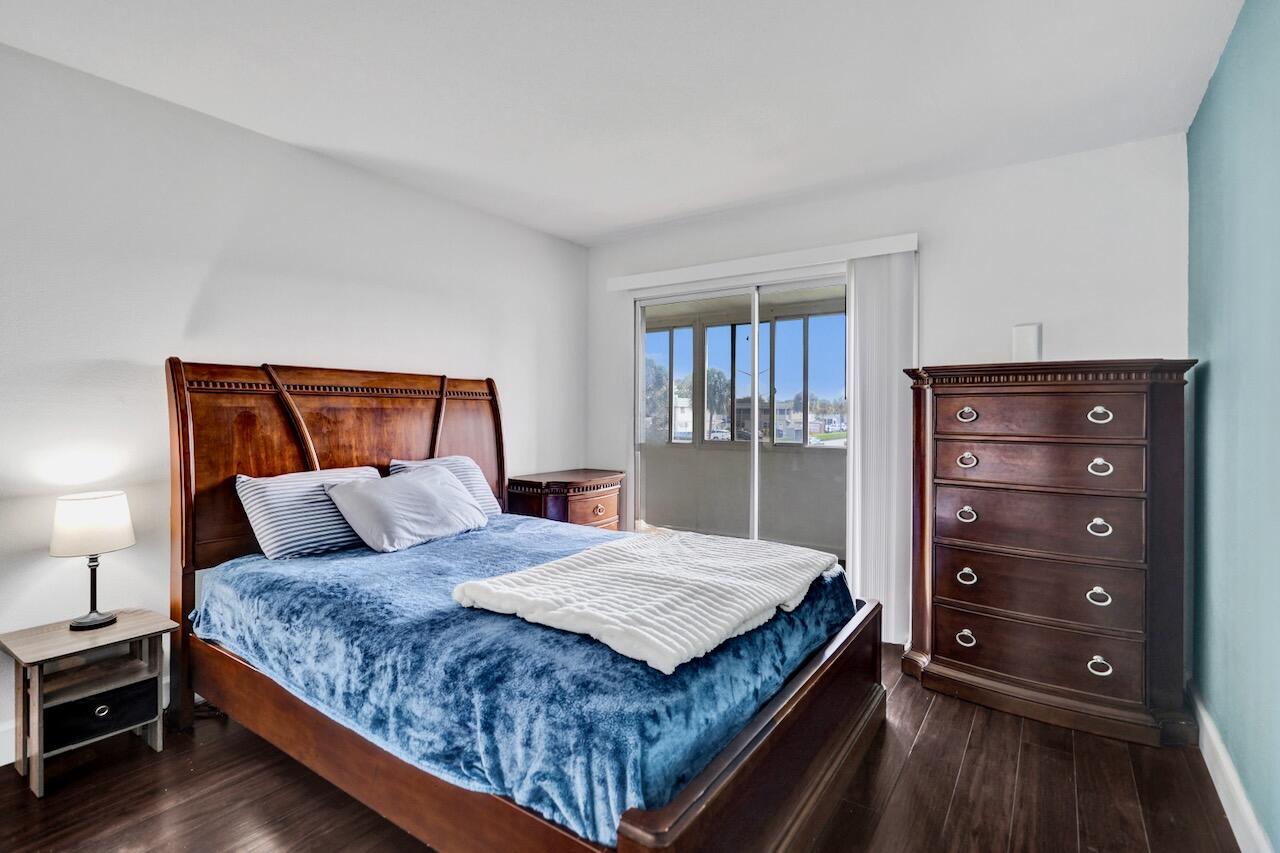 505 Monaco Way Delray Beach, FL 33446 - Photo 25 of 58 a bedroom with a bed and a dresser