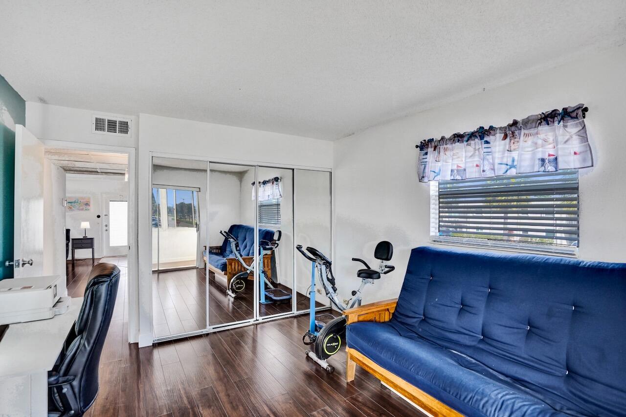 505 Monaco Way Delray Beach, FL 33446 - Photo 36 of 58 a view of a workspace with furniture and wooden floor