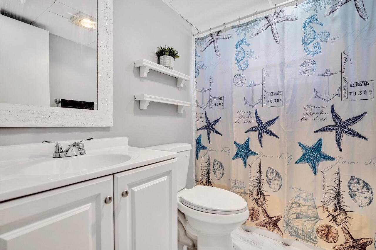 505 Monaco Way Delray Beach, FL 33446 - Photo 37 of 58 a bathroom with a sink toilet and shower
