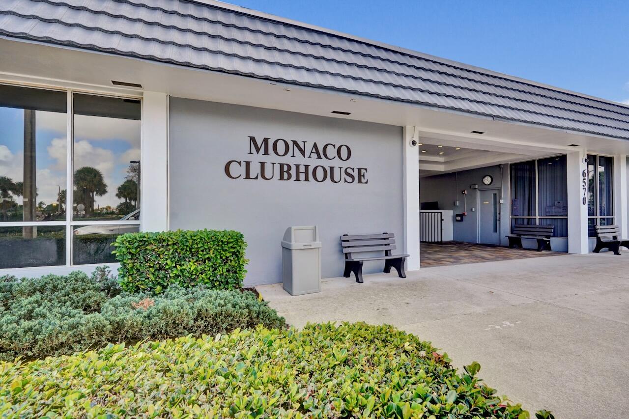 505 Monaco Way Delray Beach, FL 33446 - Photo 49 of 58 a view of a building with potted plants