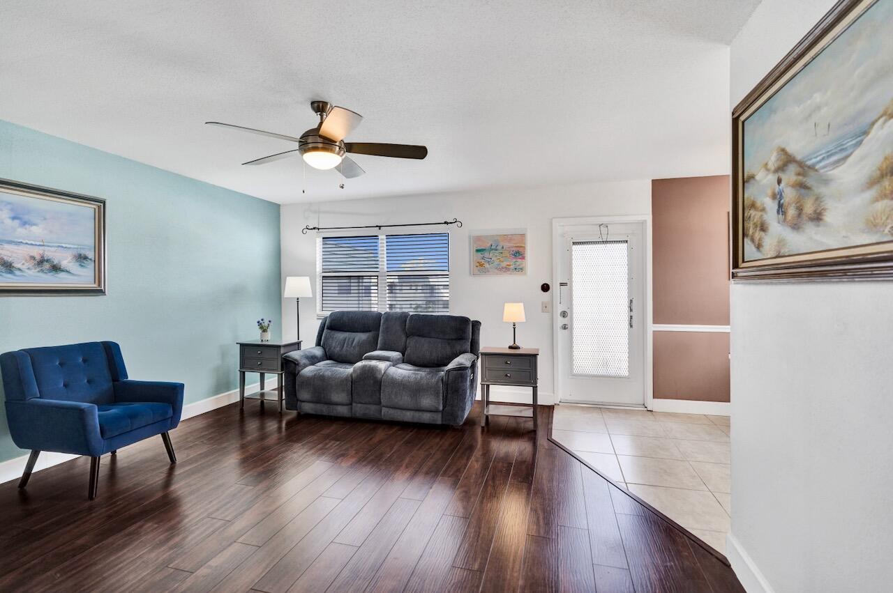 505 Monaco Way Delray Beach, FL 33446 - Photo 10 of 58 a living room with furniture and wooden floor
