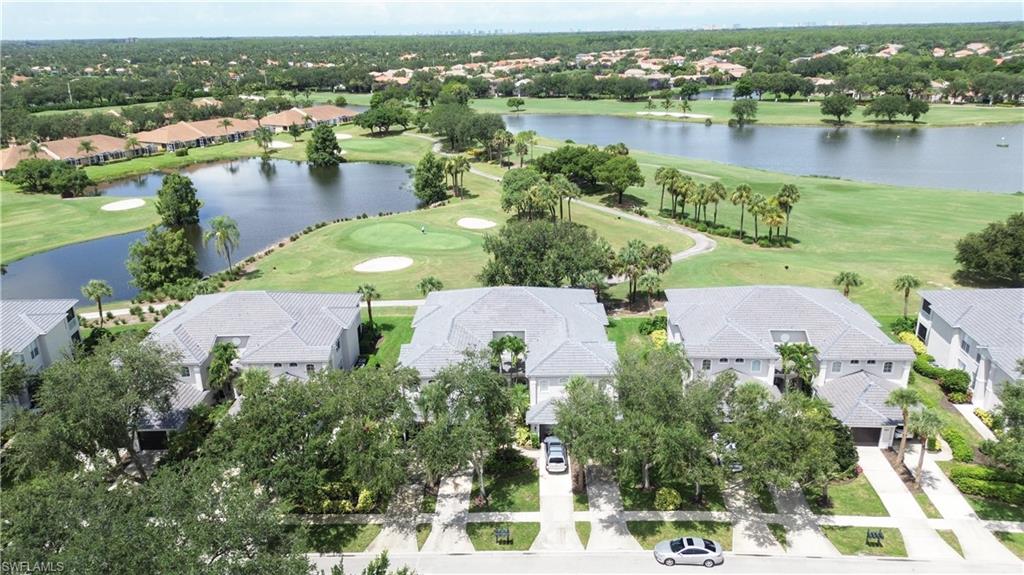 1937 Crestview Way, Unit 171 Naples, FL 34119 - Photo 1 of 39 an aerial view of residential houses with outdoor space and lake view