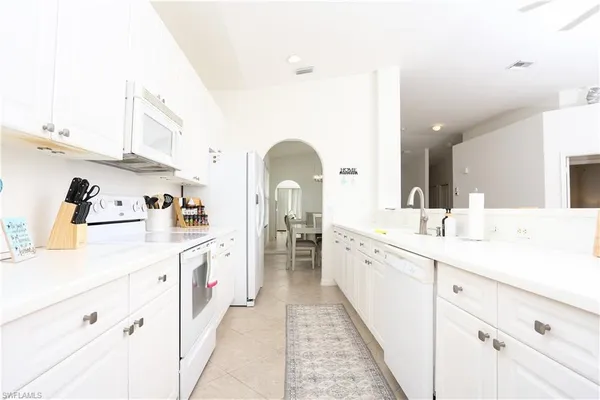 a spacious bathroom with a double vanity sink and a mirror