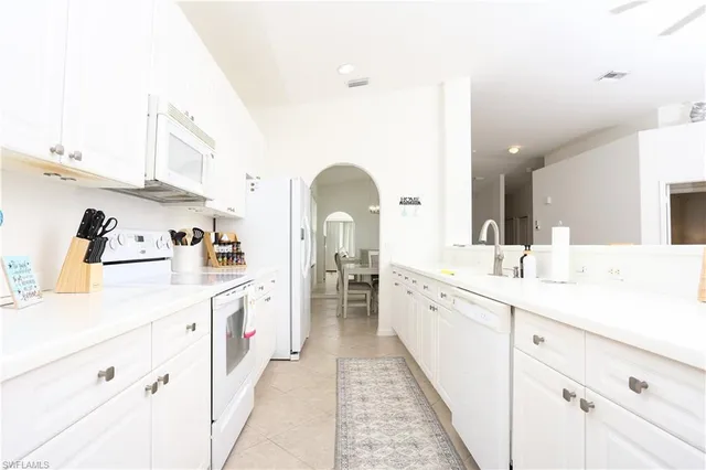 a spacious bathroom with a double vanity sink and a mirror