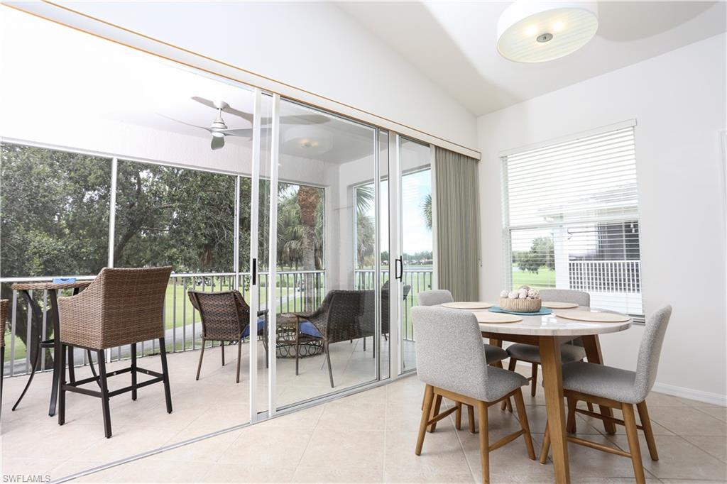 1937 Crestview Way, Unit 171 Naples, FL 34119 - Photo 13 of 39 a view of a dining room with furniture window and outside view