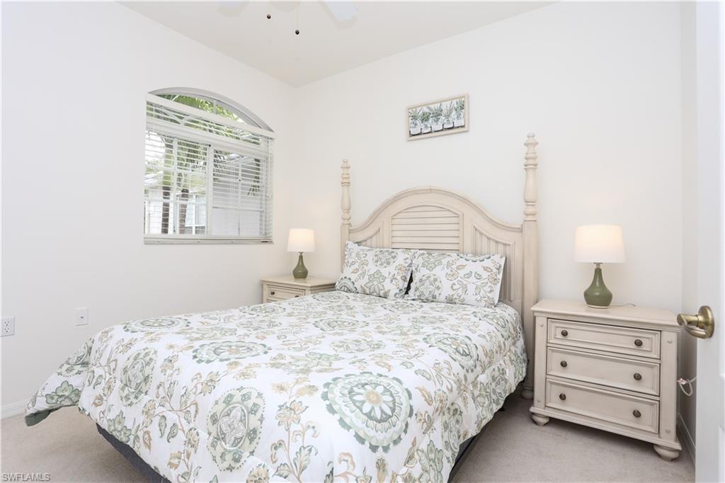 1937 Crestview Way, Unit 171 Naples, FL 34119 - Photo 20 of 39 a bedroom with a bed and a window