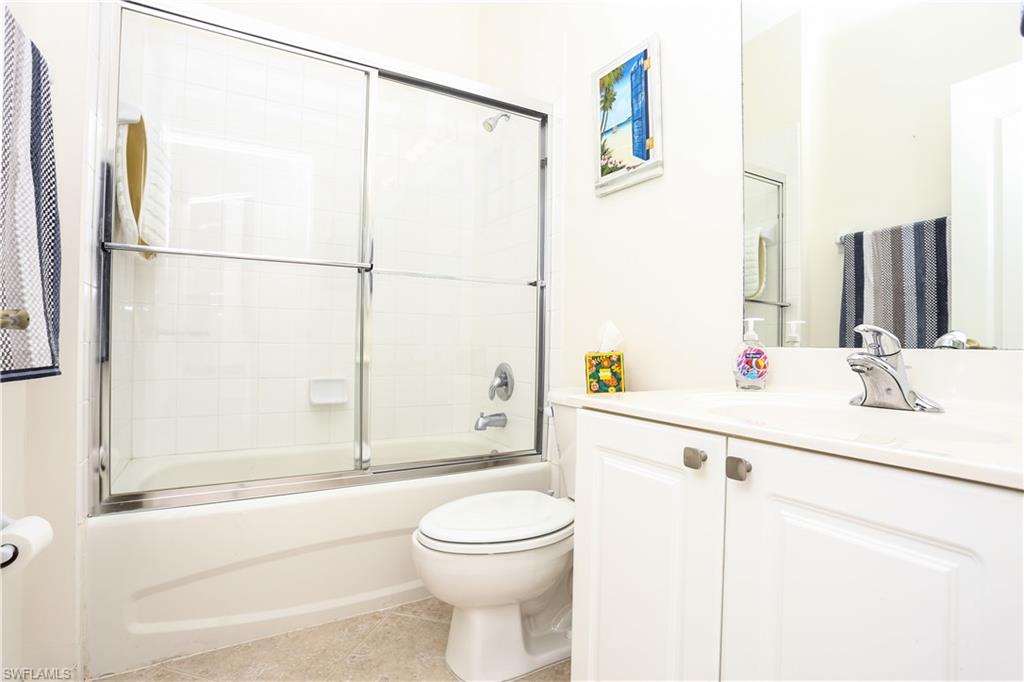 1937 Crestview Way, Unit 171 Naples, FL 34119 - Photo 21 of 39 a bathroom with a sink a toilet and shower